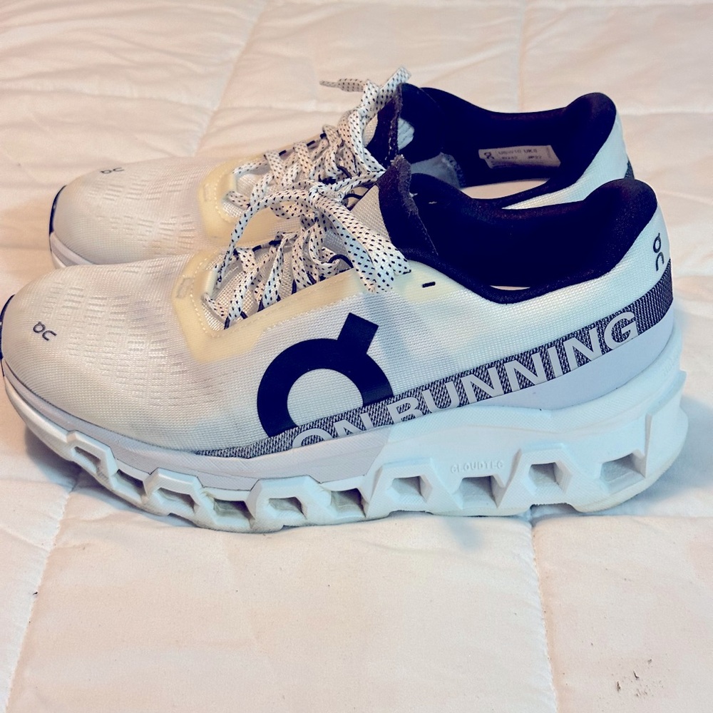 On Cloud White and Black size 9 running Shoe.